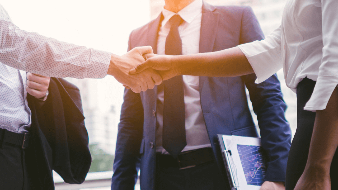 Business handshake | Scott Legal, P.C. Business man and woman shaking hands