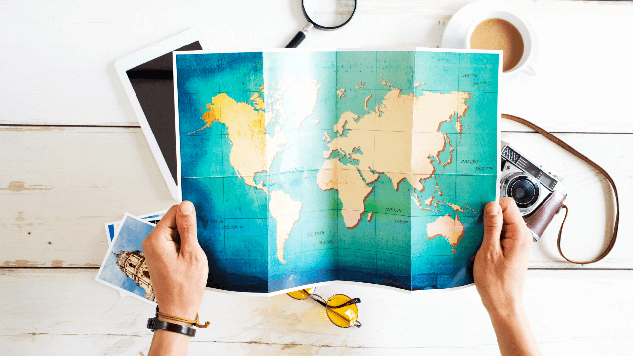 Man holding a map | Scott Legal, P.C. Man holding a map