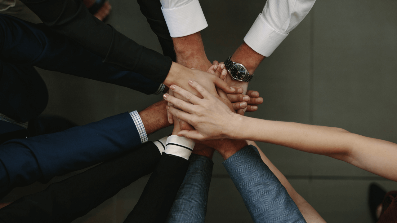 Multicultural Hands | Scott Legal, P.C. Multicultural hands in a pile - teamwork