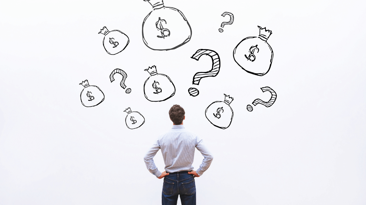 Man looking at money | Scott Legal, P.C. man looking at bags of money in confusion