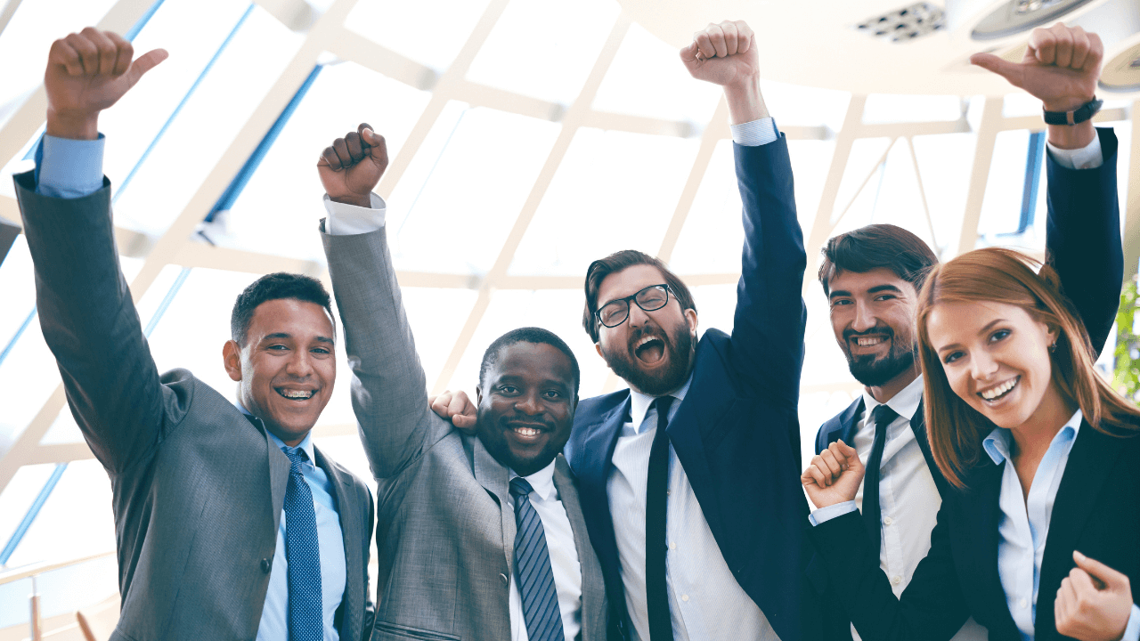 Business team celebrating | Scott Legal, P.C. Business team celebrating