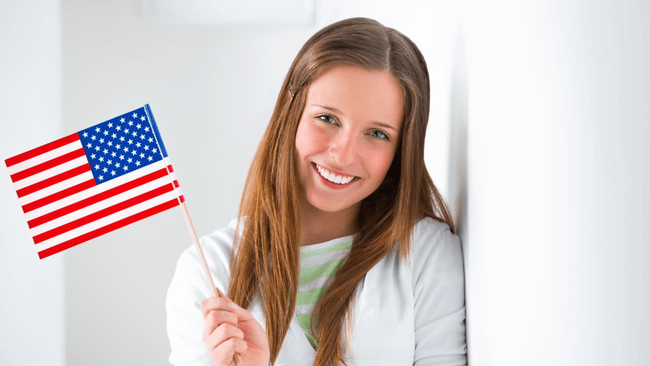 Woman holding American flag | Scott Legal, P.C. Woman holding American flag
