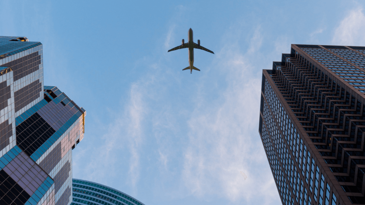 city view of an airplane from below | Scott Legal, P.C. city view of an airplane from below