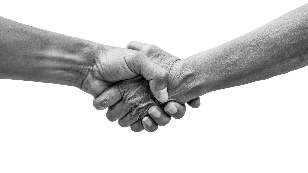 two hands meeting in the middle | Scott Legal, P.C. two hands meeting in the middle