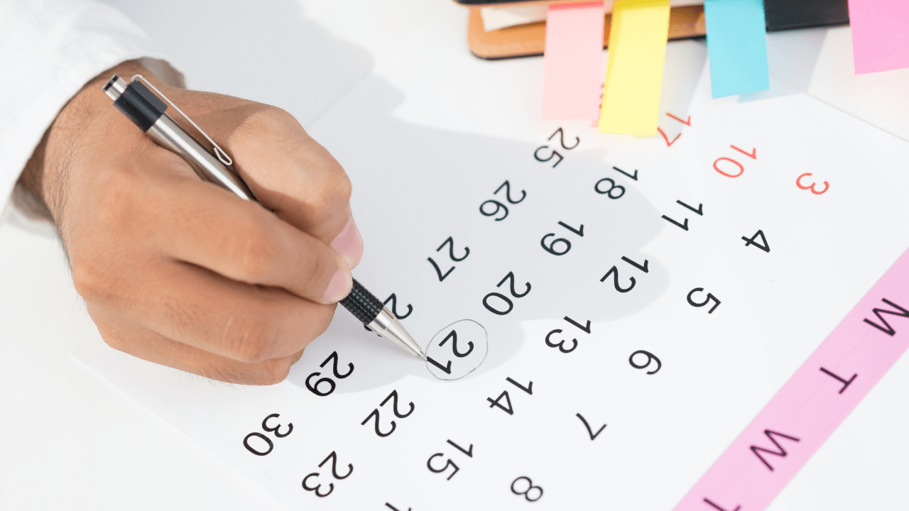 Man scheduling on a calendar | Scott Legal, P.C. Man scheduling on a calendar