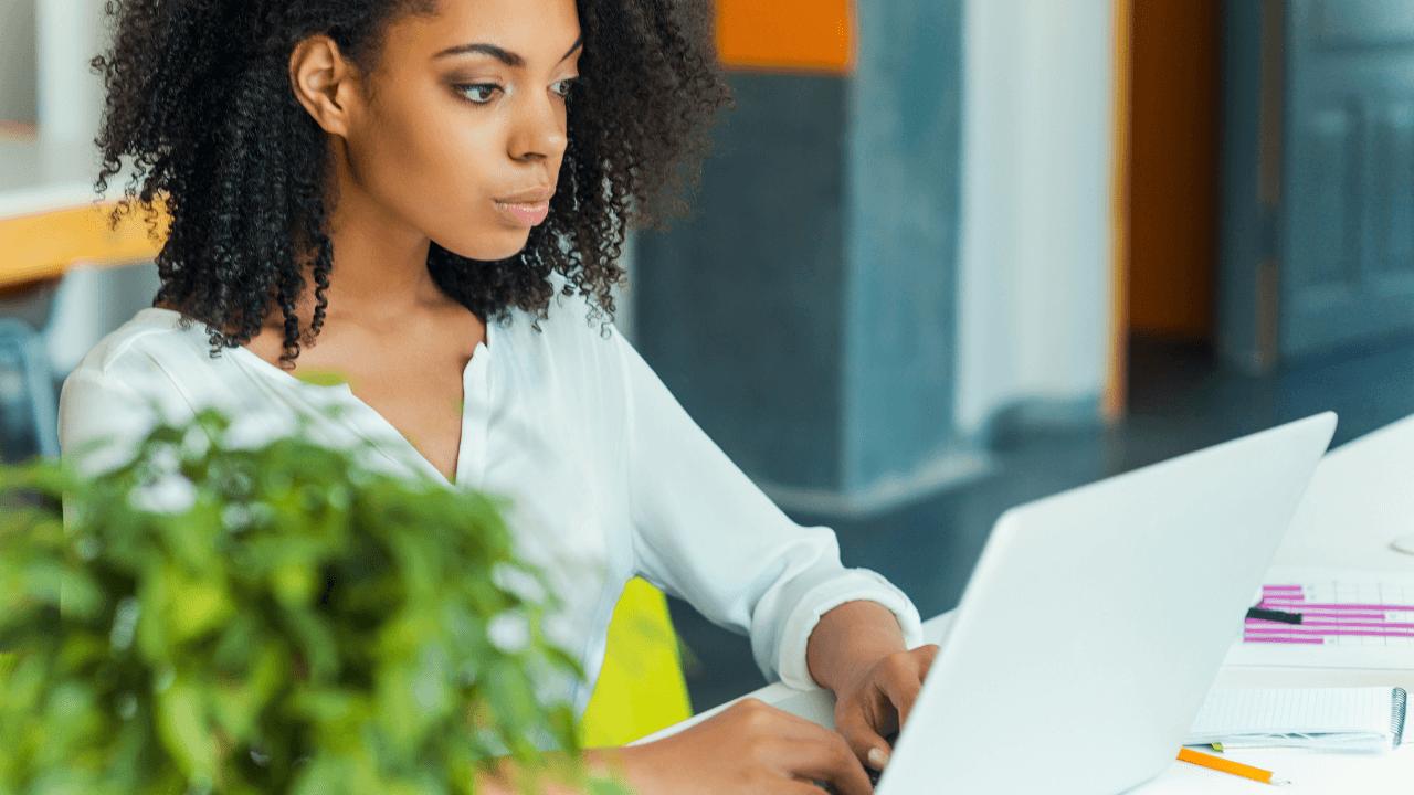 A woman working on her laptop | Scott Legal, P.C. A woman working on her laptop