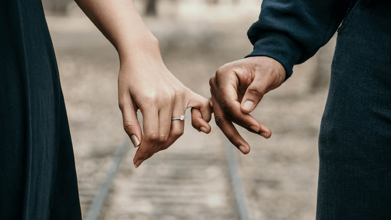 married couple holding hands | Scott Legal, P.C. married couple holding hands