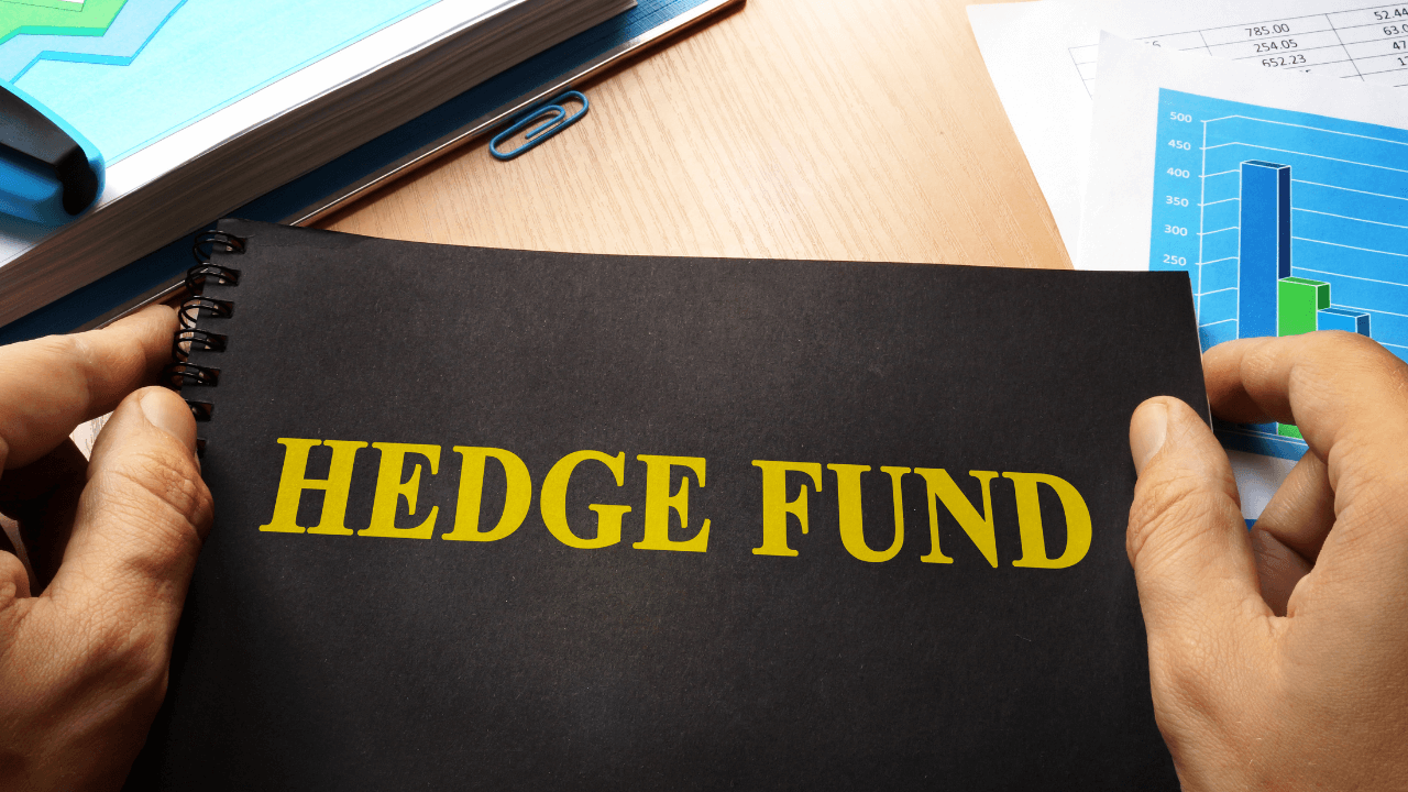 Man holding hedge fund binder | Scott Legal, P.C. Man holding hedge fund binder