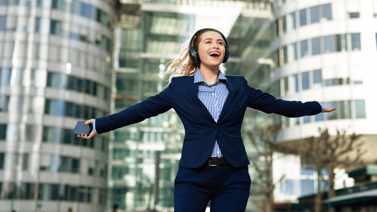 A woman celebrating in the city | Scott Legal, P.C. A woman celebrating in the city