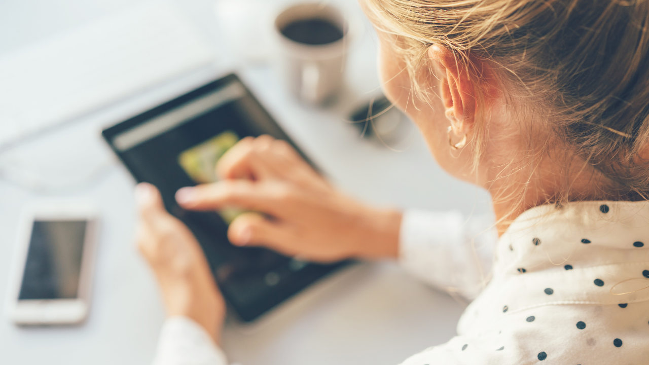 Lady looking at blog posts | Scott Legal, P.C. Lady looking at blog posts