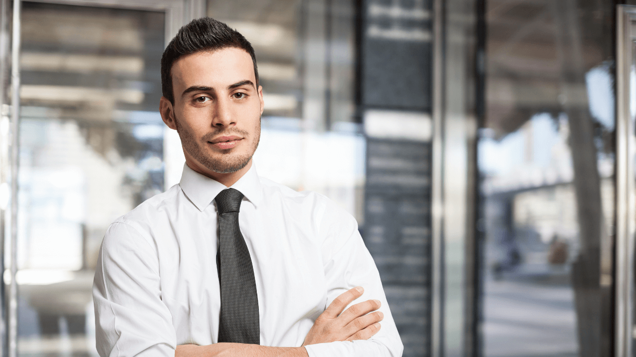 Business man standing in his office | Scott Legal, P.C. Business man standing in his office