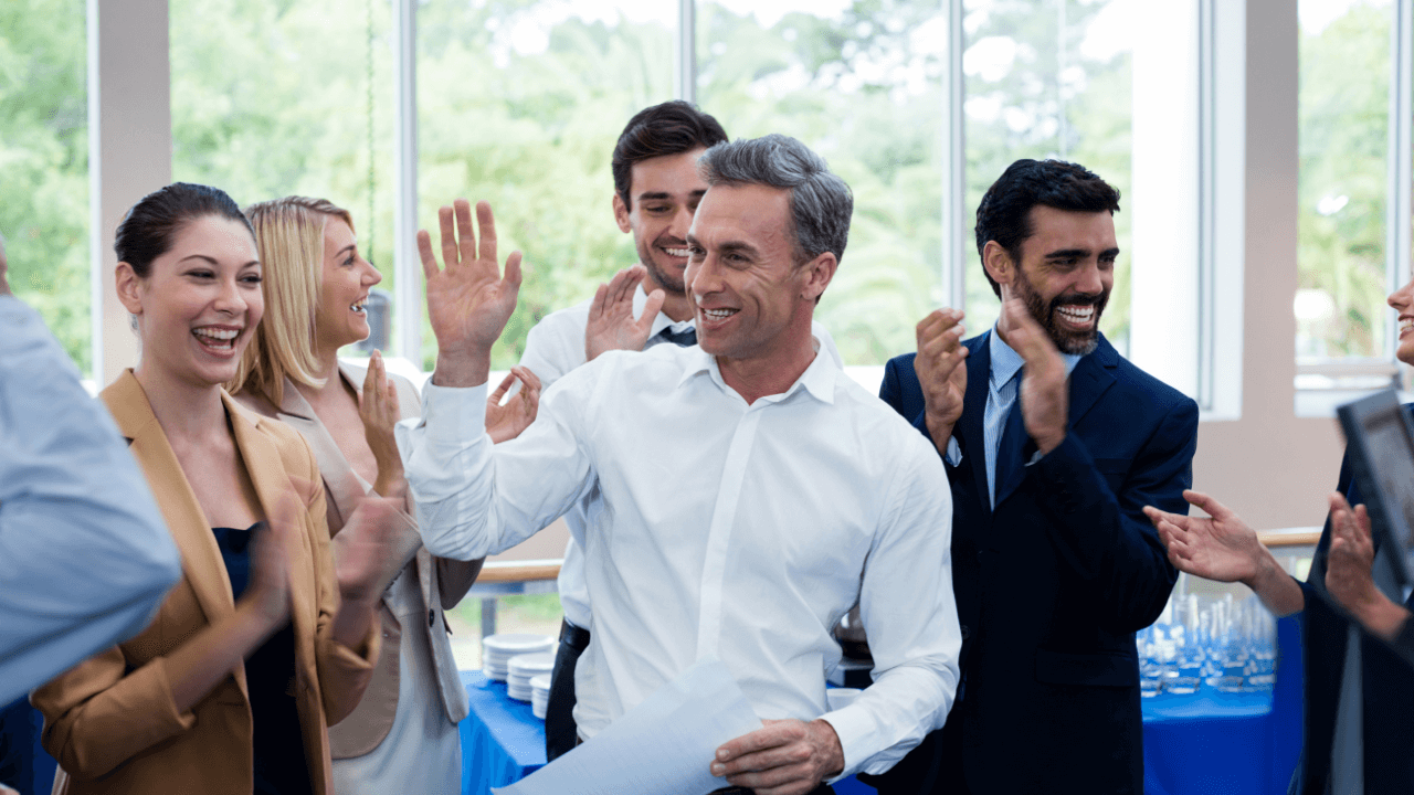 Office team celebrating a win | Scott Legal, P.C. Office team celebrating a win