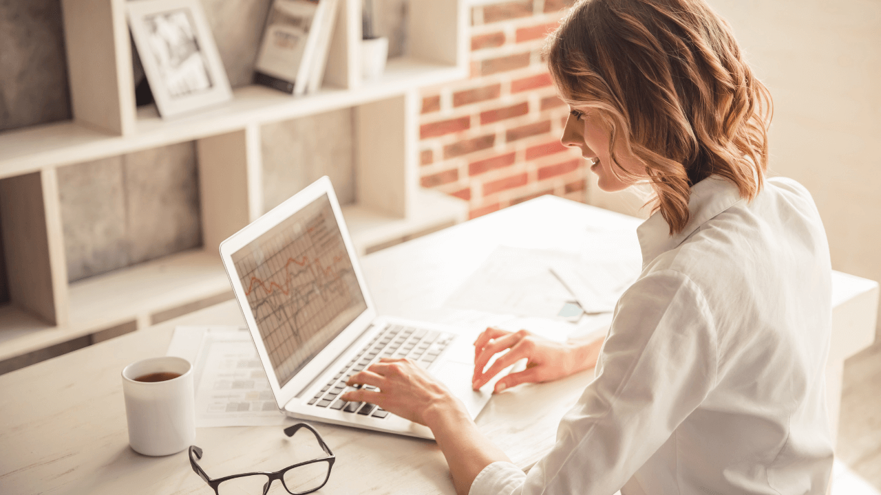 A business woman working from home on her laptop | Scott Legal, P.C. A business woman working from home on her laptop