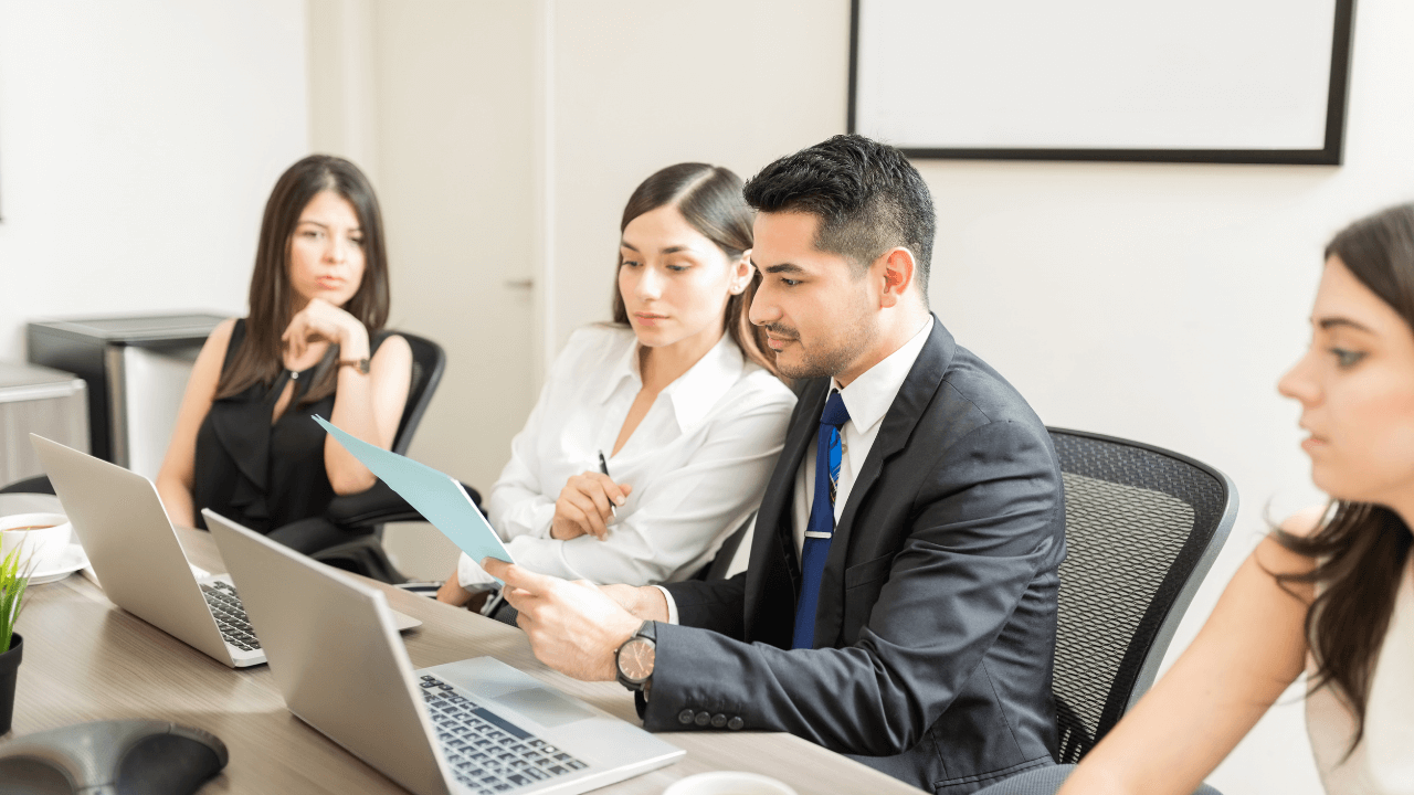 An office team during a team meeting | Scott Legal, P.C. An office team during a team meeting
