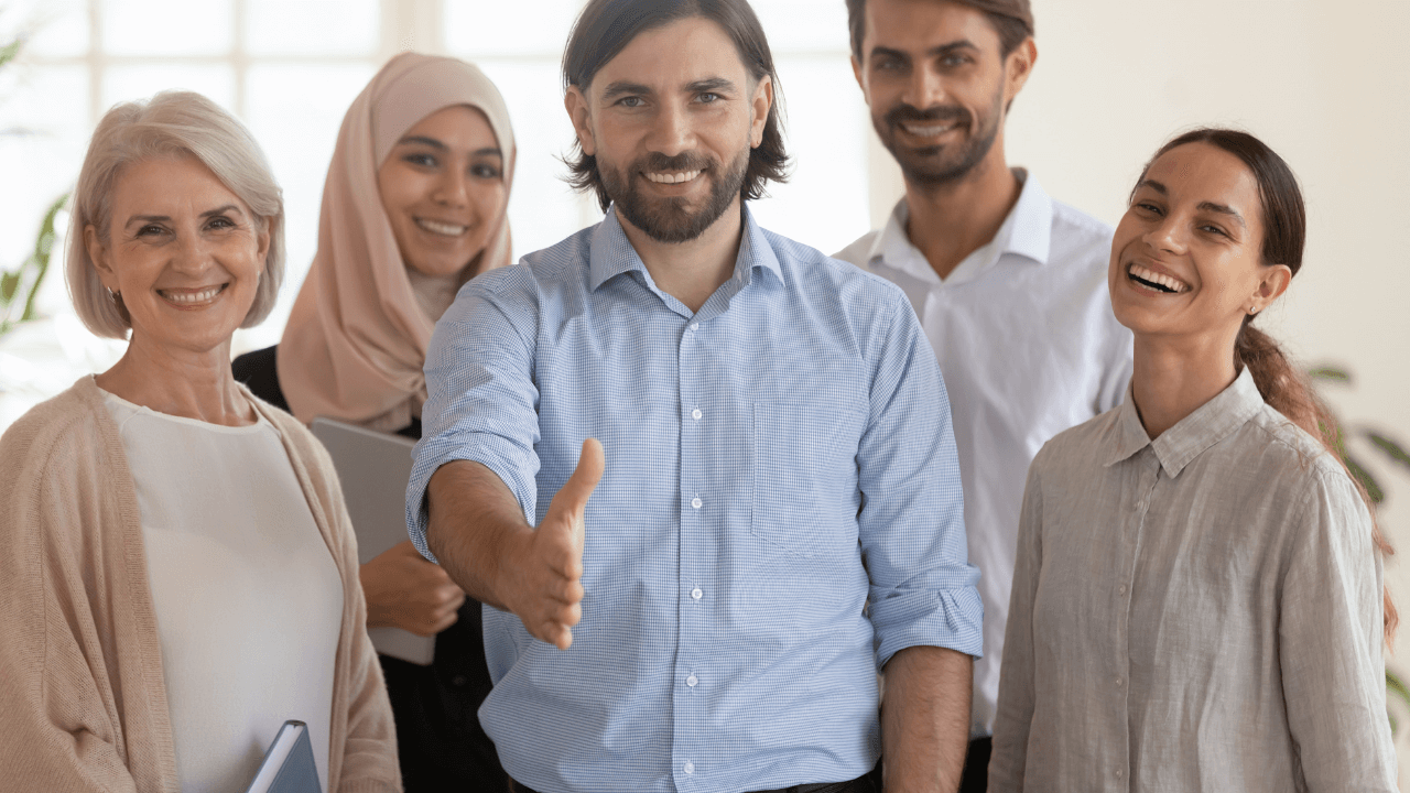 An office team welcoming a new person | Scott Legal, P.C. An office team welcoming a new person