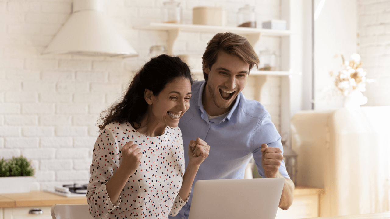 Two people celebrating an approval | Scott Legal, P.C. Two people celebrating an approval