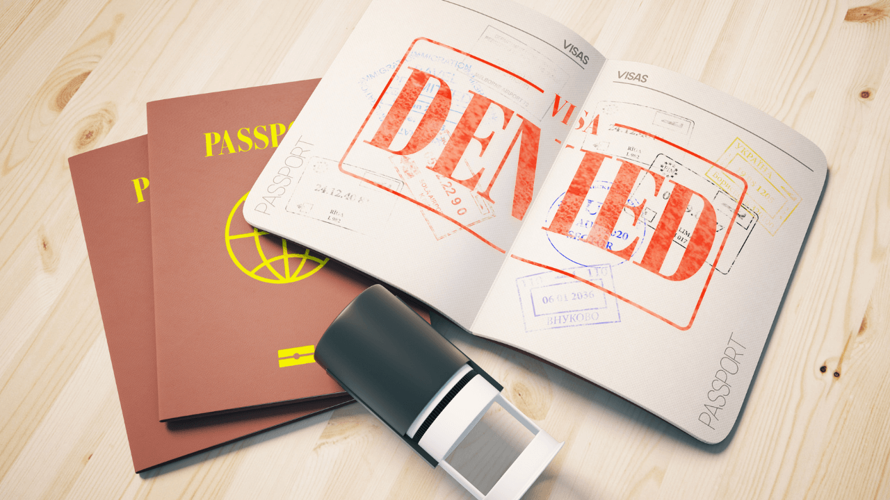 A denied visa stamp in a passport | Scott Legal, P.C. A denied visa stamp in a passport
