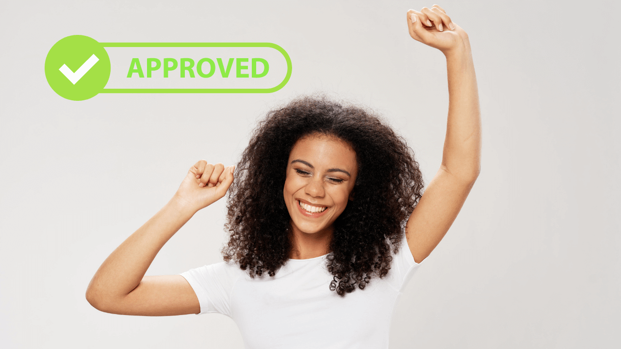 A woman celebrating her most recent approval | Scott Legal, P.C. A woman celebrating her most recent approval