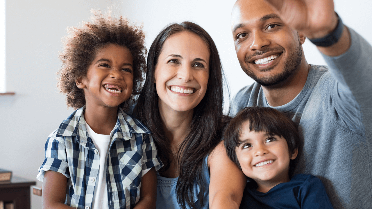 A family of 4 taking a selfie together | Scott Legal, P.C. A family of 4 taking a selfie together