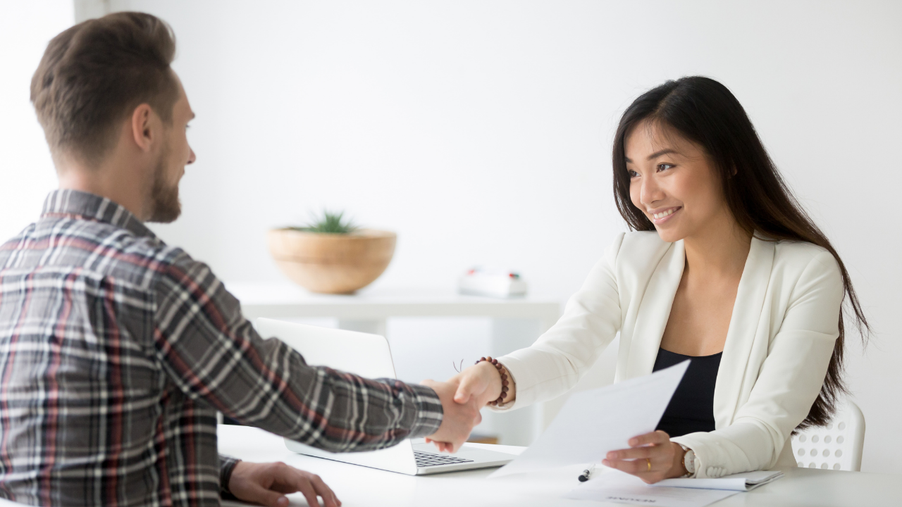 A job offered after an interview | Scott Legal, P.C. Two pwople shaking hands to solidify a A job offered after an interview