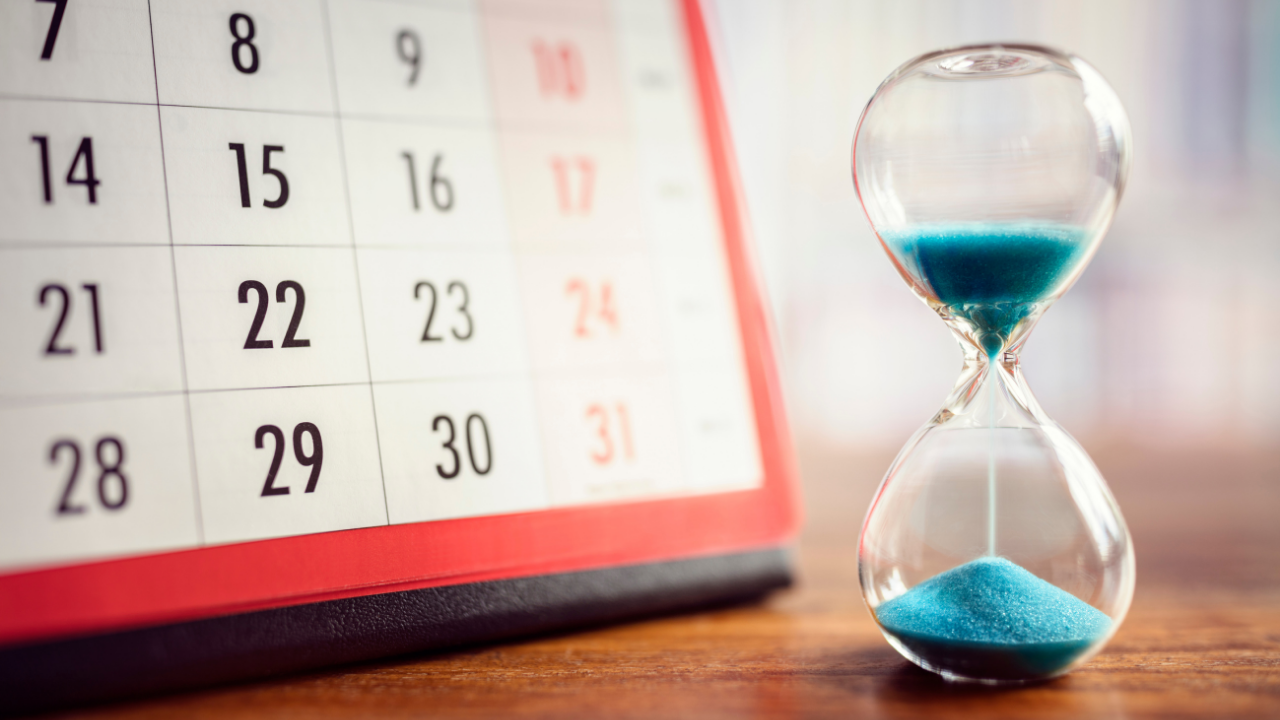 A calendar and hour glass counting down time | Scott Legal, P.C. A calendar and hour glass counting down time