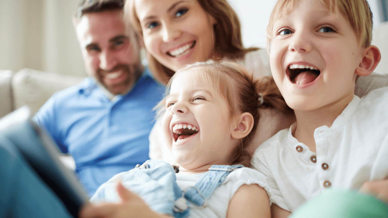 A family of two adults and two children spending quality time together | Scott Legal, P.C. A family of two adults and two children spending quality time together