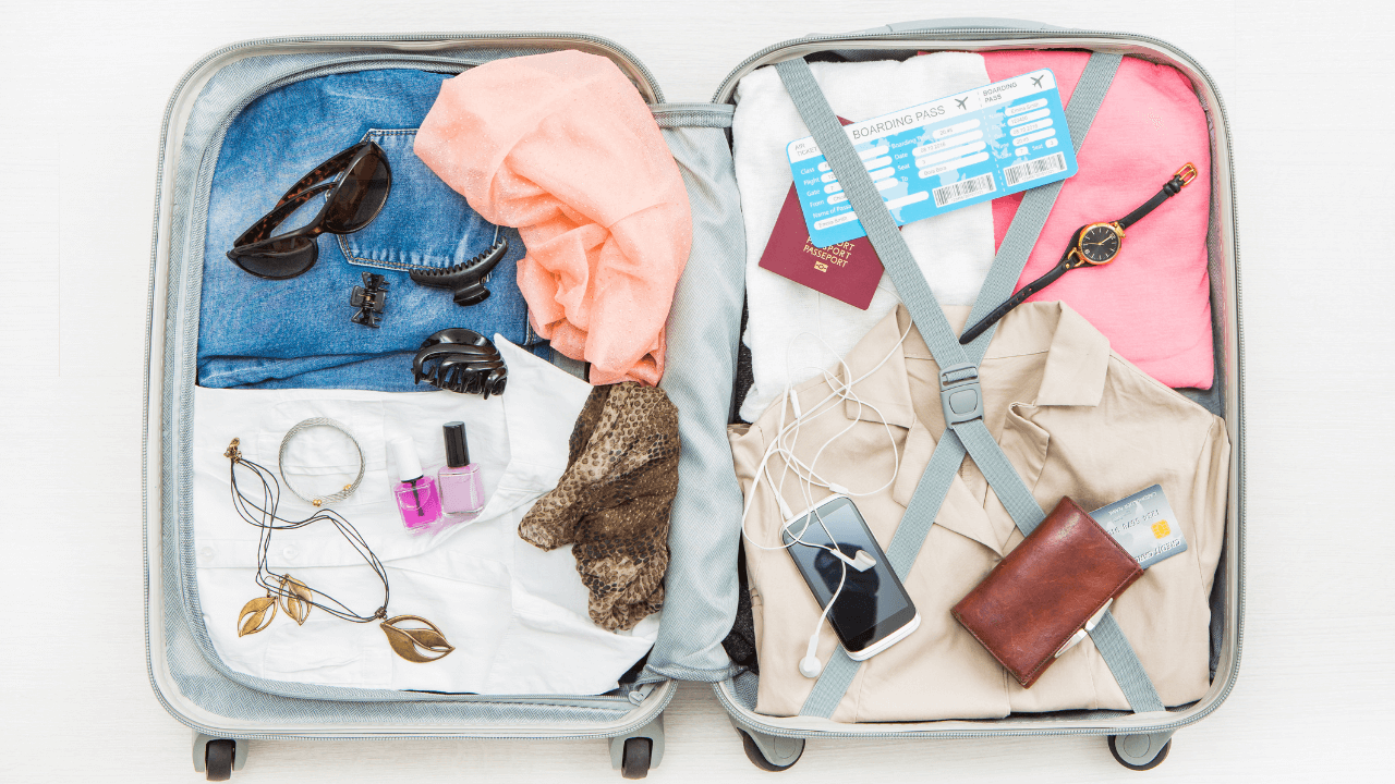 A suitcase full of clothing, a passport, boarding pass, phone and wallet | Scott Legal, P.C. A suitcase full of clothing, a passport, boarding pass, phone and wallet