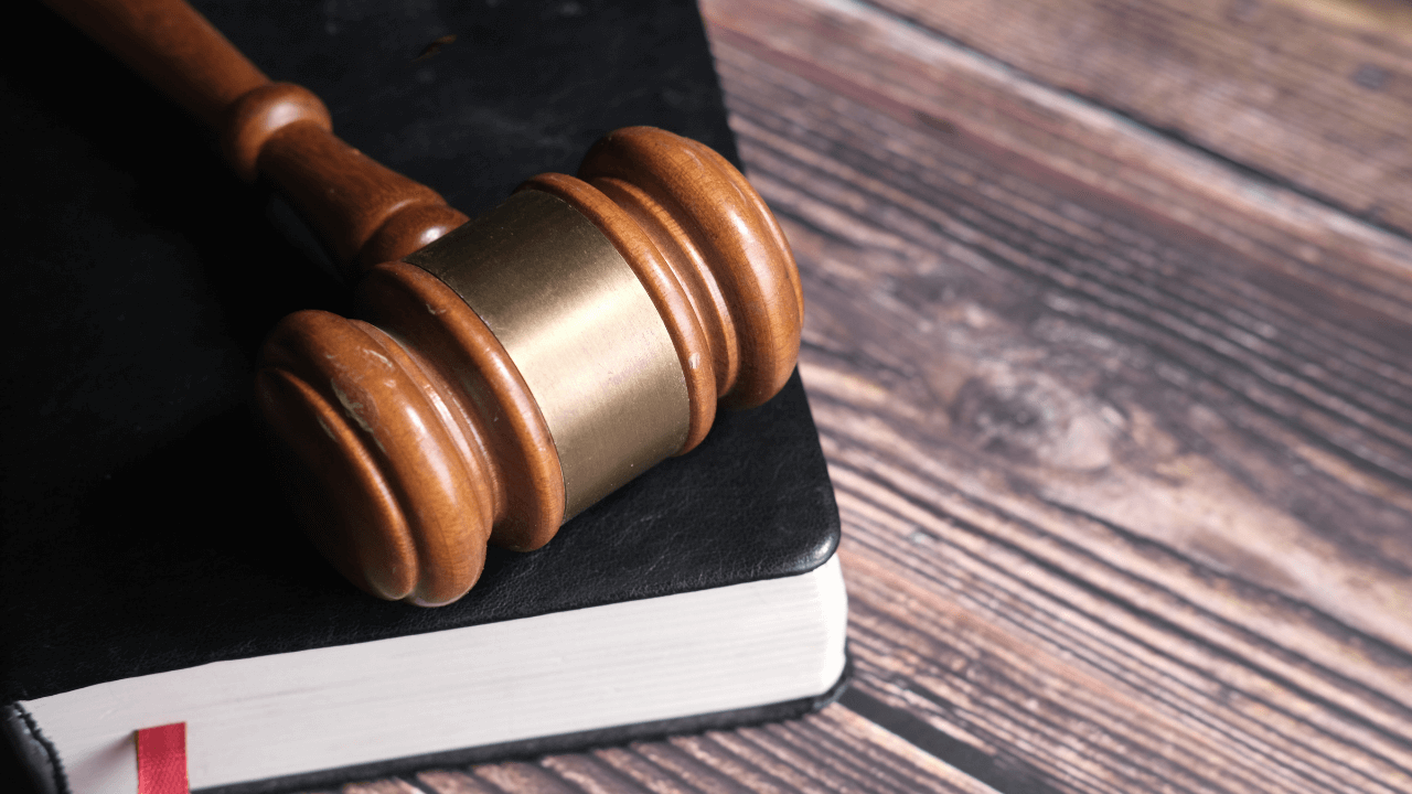 A book with a gavel on top of it | Scott Legal, P.C. A book with a gavel on top of it