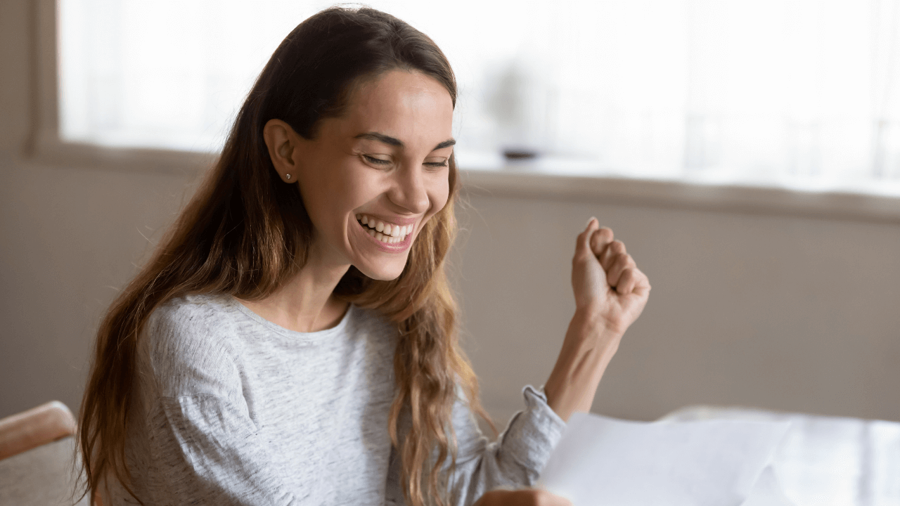 A woman celebrating an approval of her O-1A Visa | Scott Legal, P.C. A woman celebrating an approval of her O-1A Visa