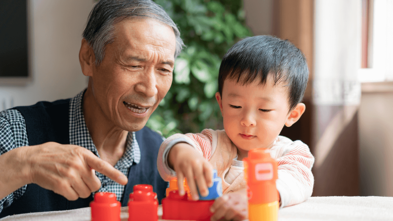 A grandfather and child playing together | Scott Legal, P.C. A grandfather and child playing together