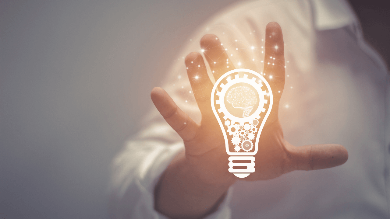 A man holding a light bulb | Scott Legal, P.C. A man holding a light bulb