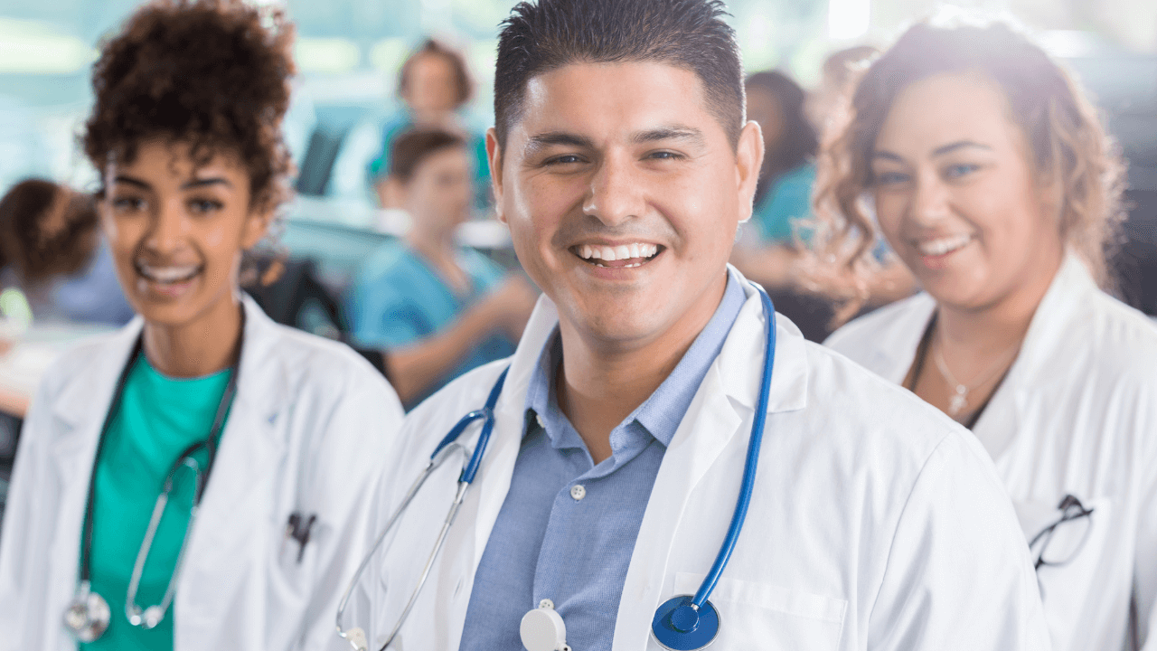 3 physician trainees smiling | Scott Legal, P.C. 3 physician trainees smiling