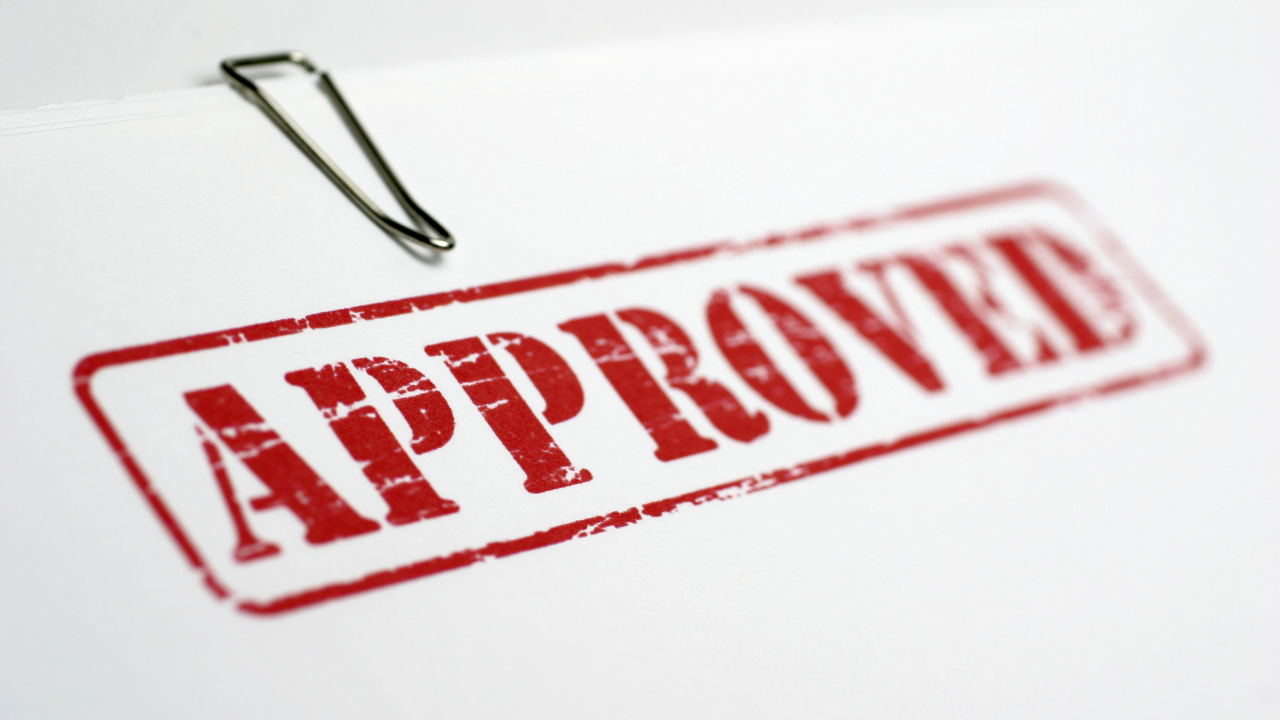 Approved stamped on a folder | Scott Legal, P.C. Approved stamped on a folder