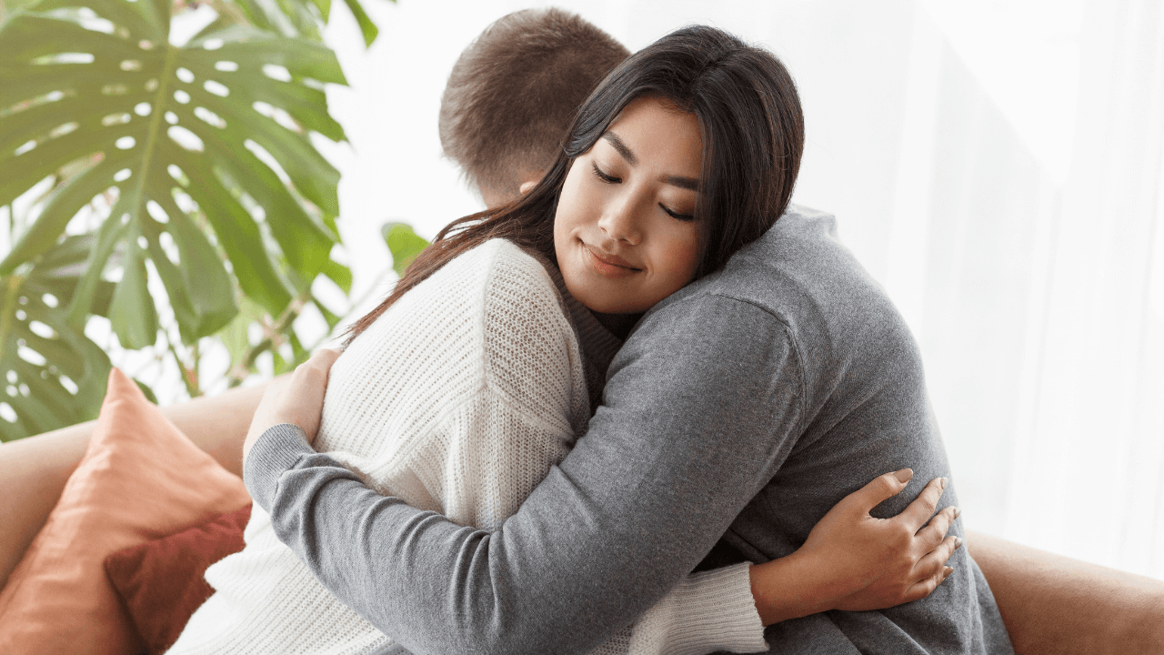 a husband and wife hugging | Scott Legal, P.C. a husband and wife hugging