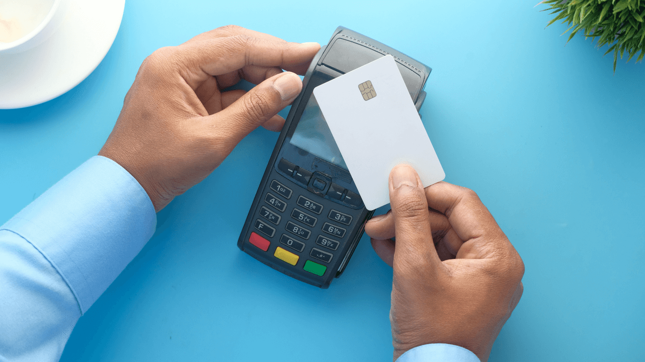 A man using his credit card as payment | Scott Legal, P.C. A man using his credit card as payment