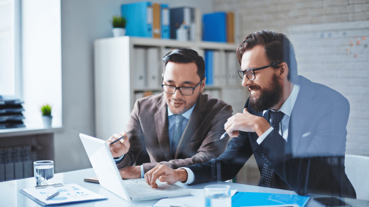 Two consultants working together | Scott Legal, P.C. Two consultants working together