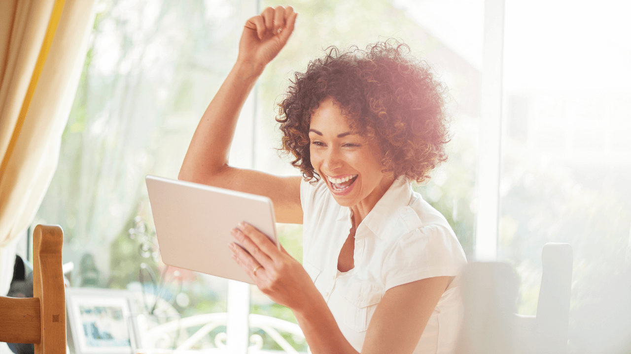 A woman celebrating a win | Scott Legal, P.C. A woman celebrating a win