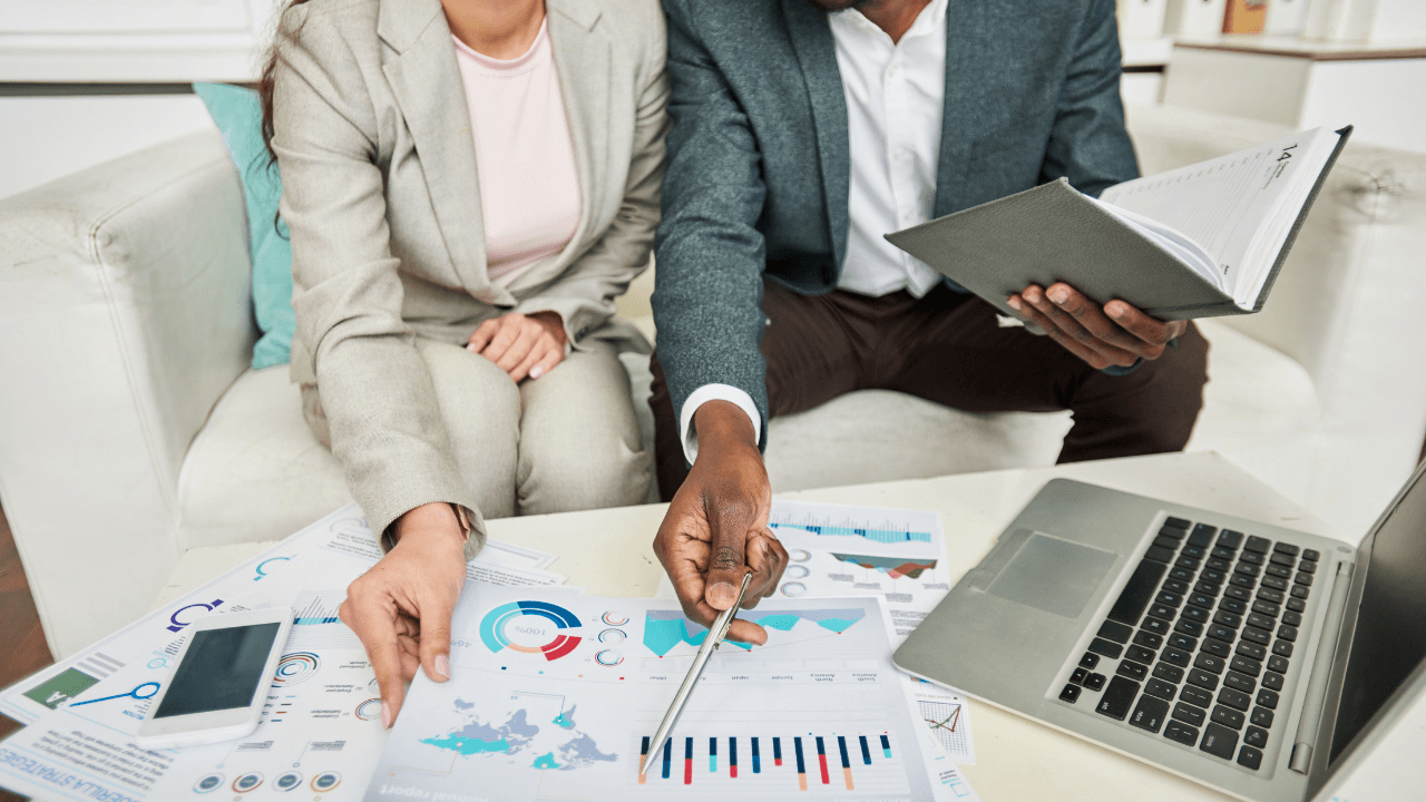 A man and woman collaborating on a business project | Scott Legal, P.C. A man and woman collaborating on a business project