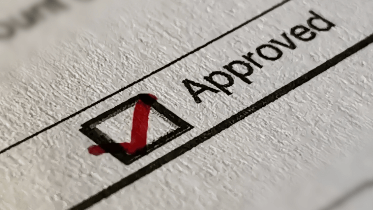 An "approved" box checked on a piece of paper | Scott Legal, P.C. An "approved" box checked on a piece of paper