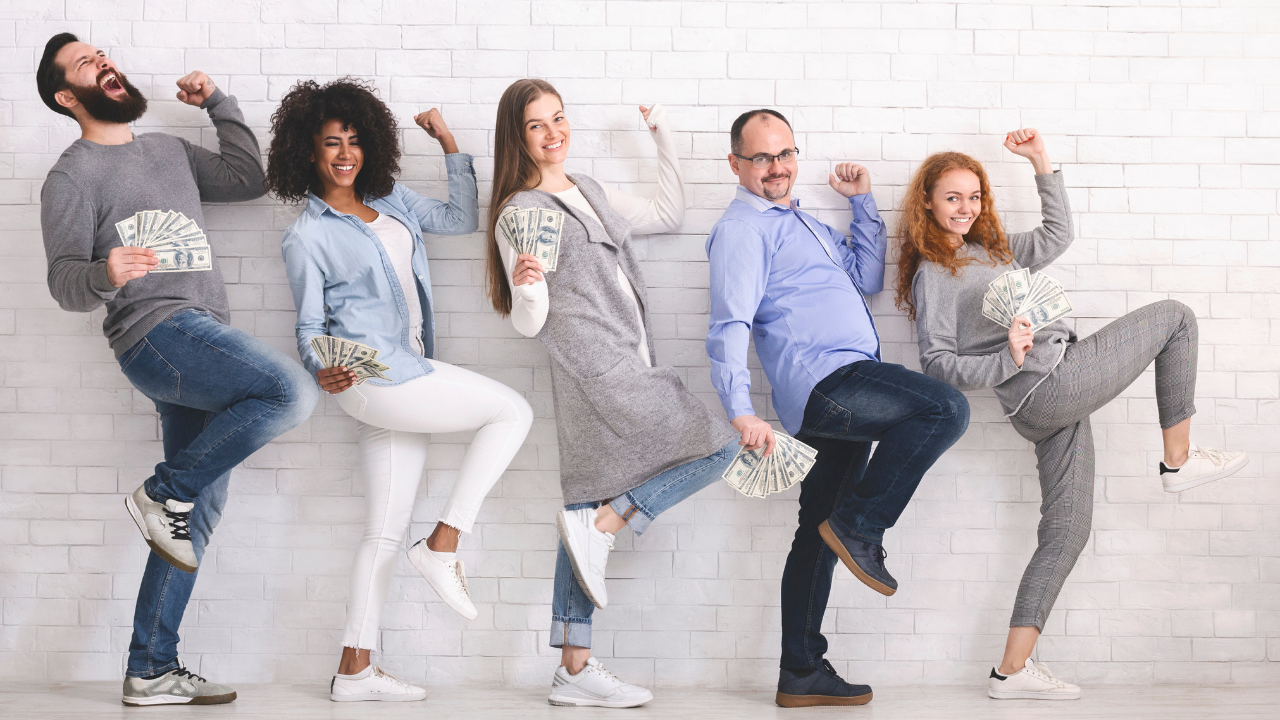 A team celebrating an E-2 investor approval | Scott Legal, P.C. A team celebrating an E-2 investor approval