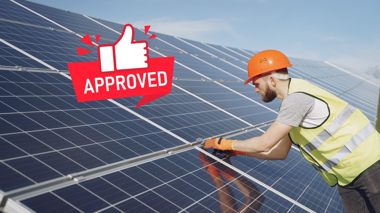a man installing solar panels to a house with an approved sign next to him | Scott Legal, P.C. a man installing solar panels to a house with an approved sign next to him