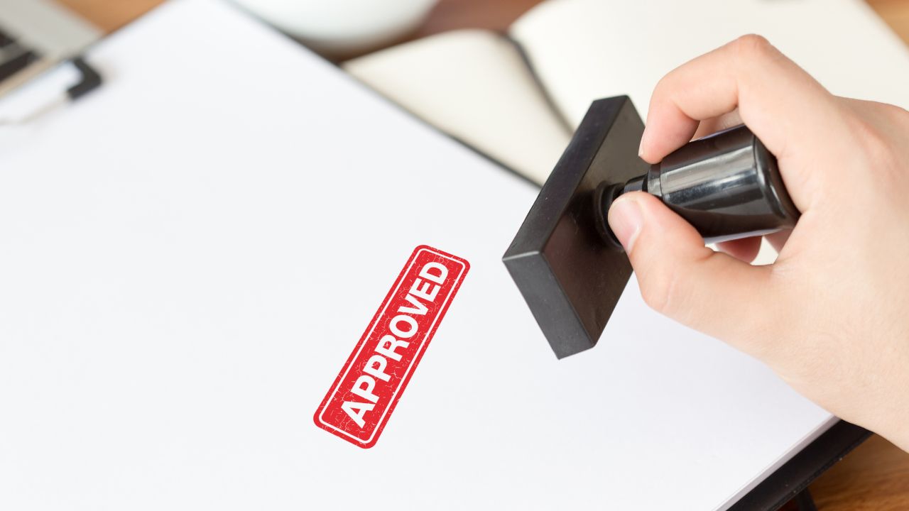 An approved stamp on paper | Scott Legal, P.C. An approved stamp on paper