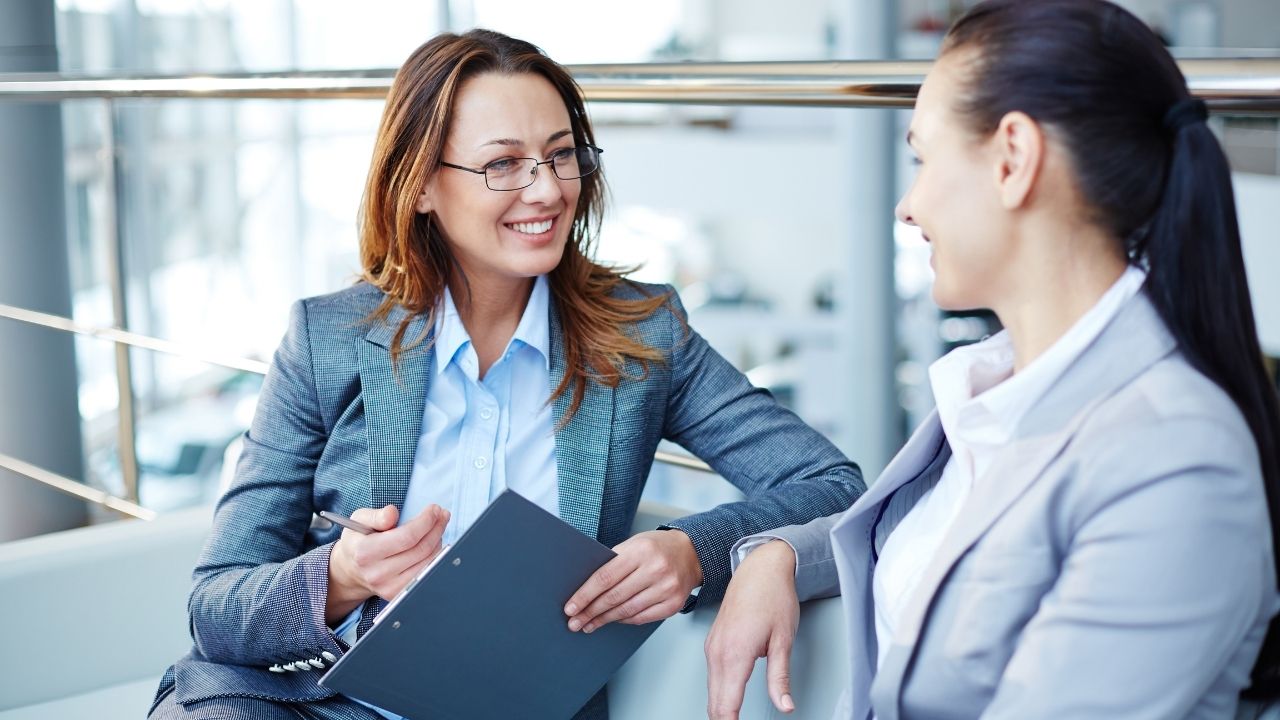 Two consultants speaking to each other | Scott Legal, P.C. Two consultants speaking to each other