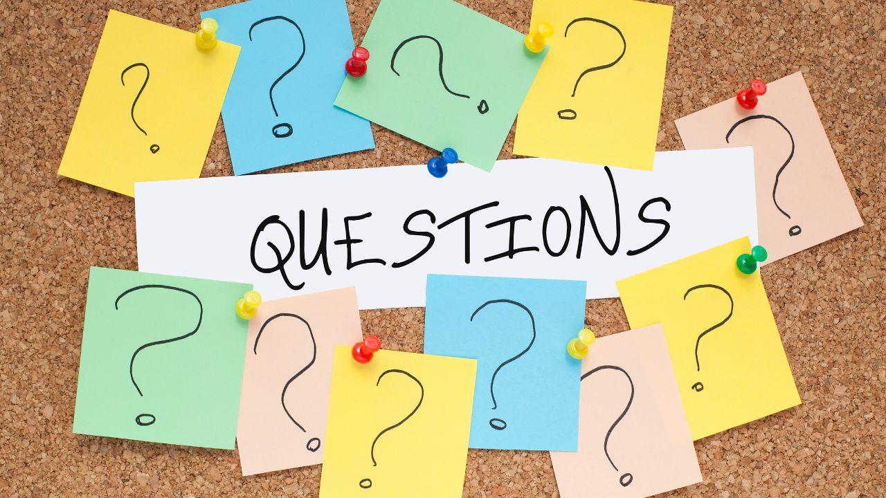 A bunch of questions pinned to a cork board | Scott Legal, P.C. A bunch of questions pinned to a cork board