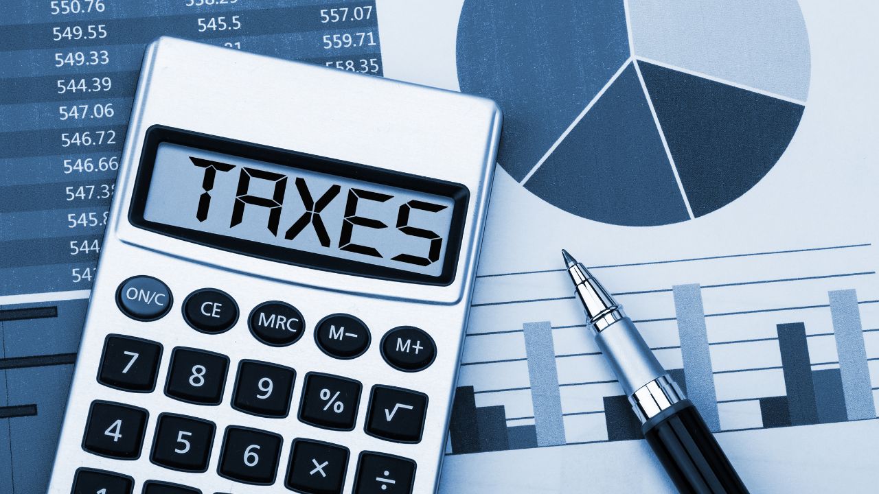 Taxes, calculator, pen, and charts | Scott Legal, P.C. Taxes, calculator, pen, and charts