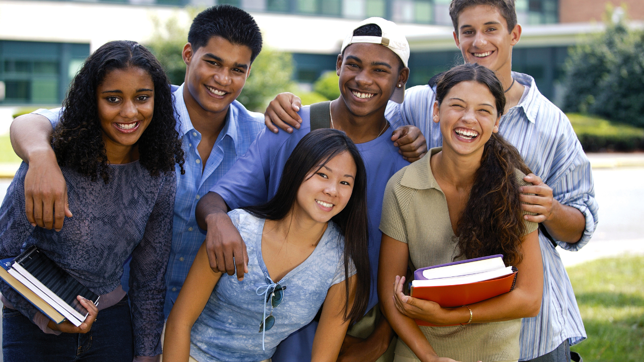 A group of teens laughing at school | Scott Legal, P.C. A group of teens laughing at school