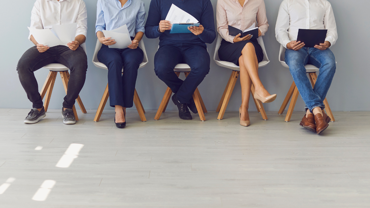 A group of people waiting to be interviewed | Scott Legal, P.C. A group of people waiting to be interviewed