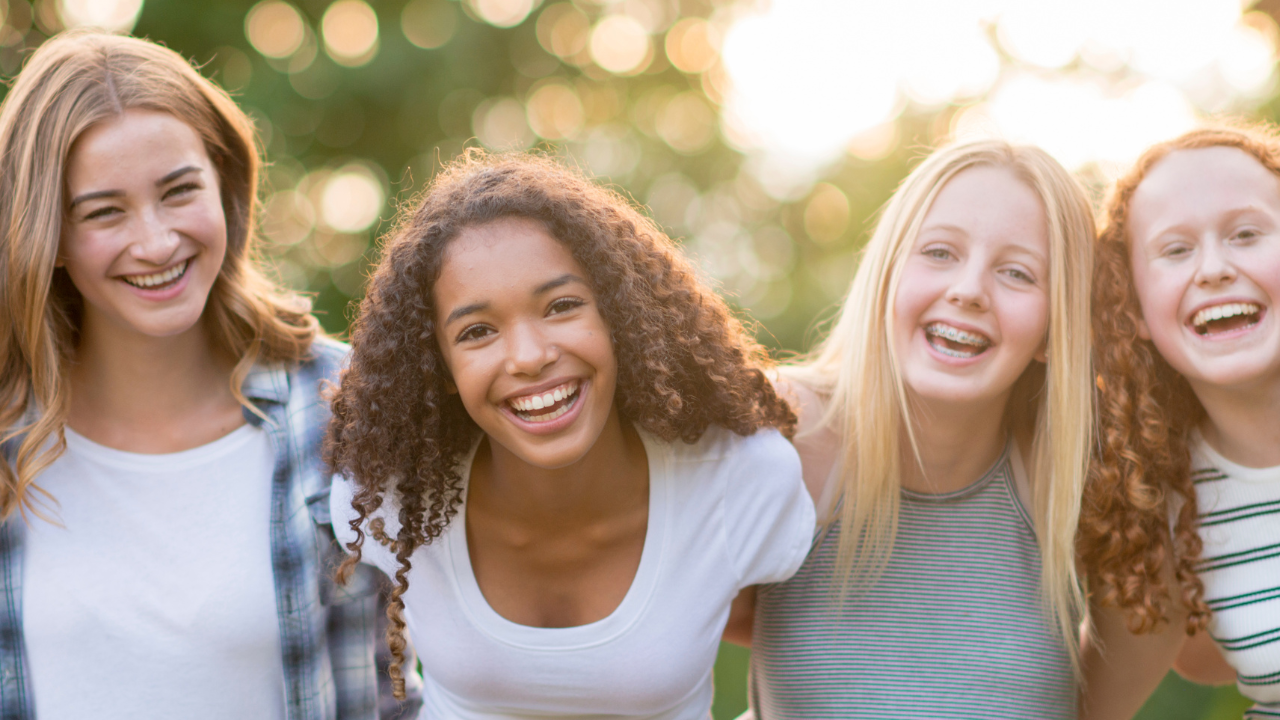 A group of teens smiling | Scott Legal, P.C. A group of teens smiling