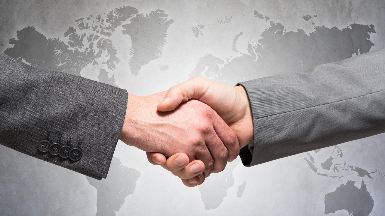Two people shaking hands | Scott Legal, P.C. Two people shaking hands
