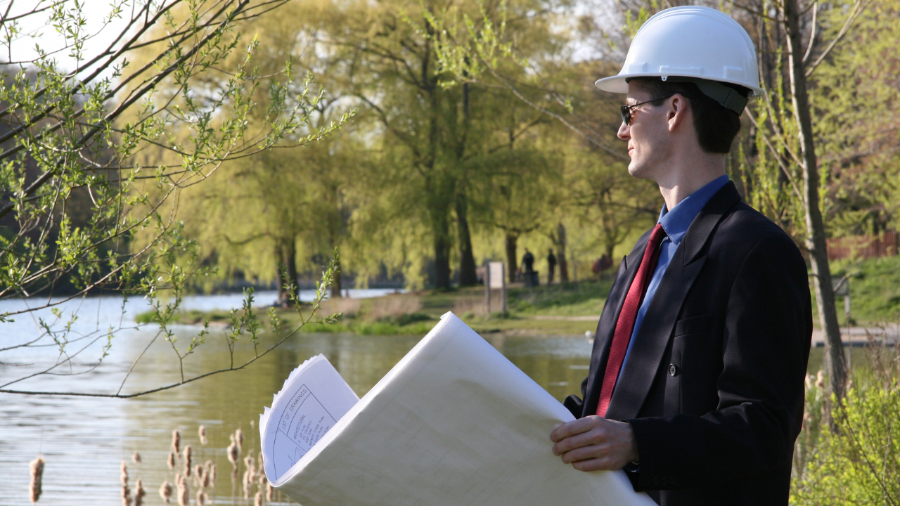 An urban planner working on a project | Scott Legal, P.C. An urban planner working on a project